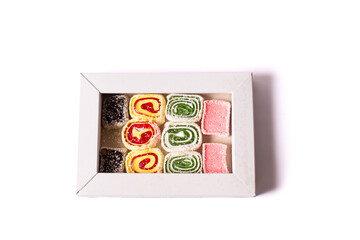 Turkish delight in box. Asian sweets isolated on a white.