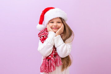 The girl in the New Year's costume is very happy and holds her hands near her head. Isolated background.