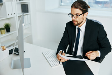 Fototapeta premium man in a suit documents in hand communication by phone Lifestyle