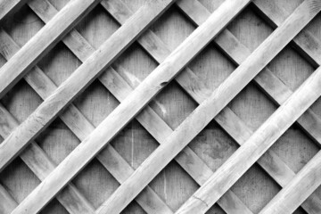 Wooden grid frame decoration element in black and white.