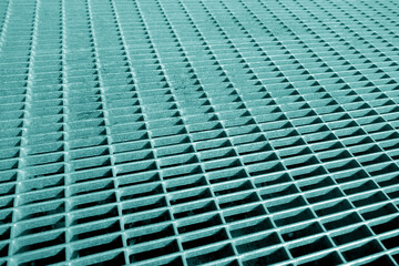 Metal grid pattern with blur effect in cyan tone.