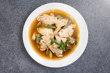 Dum chicken biriyani, serving bowl and garnished on the desk