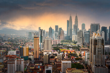 Panorama view of Kuala Lumpur business distric skyscraper with colorful sunrise sky background, Malaysia.