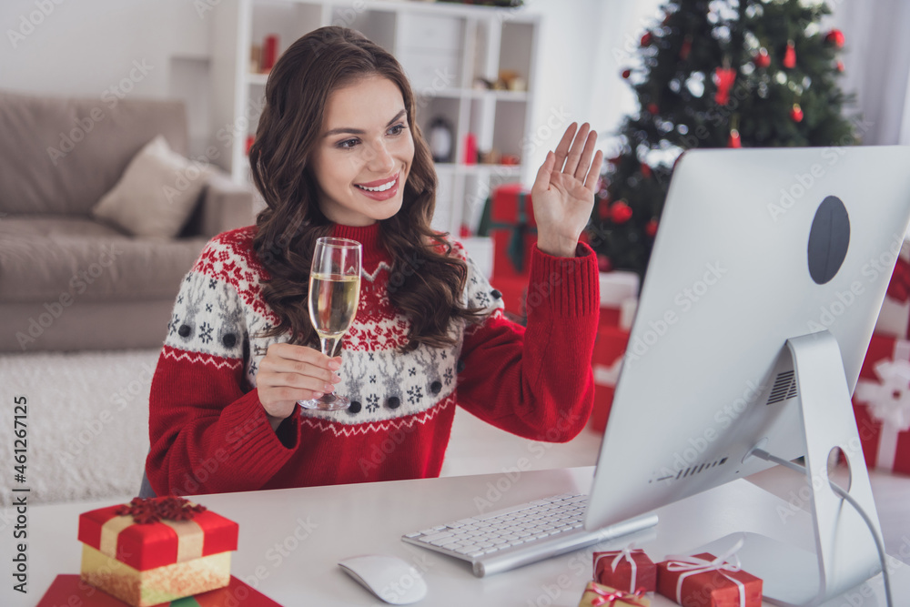 Sticker Portrait of attractive cheerful wavy-haired girl calling video waving hello talking eve evening at workplace light white home indoors