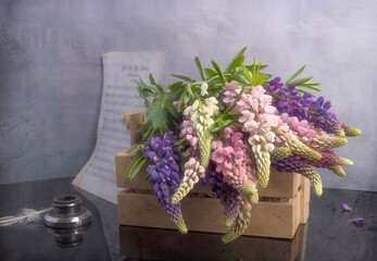 still life with lupines, shot on a gray background