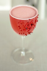 Red cocktail decorated with dried fruits at a restaurant