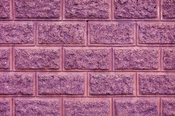 Разноцветная кладка каменной стены здания. Архитектура, строительство и дизайн зданий с каменными стенами