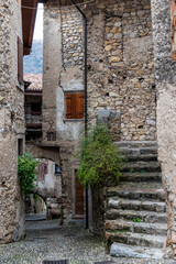 Fototapeta na wymiar Canale, Italy 10-20-2020. Street at medieval village of Canale di Tenno in Italy.