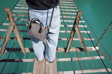 20s woman at the Suspension Bridge of Dreams in Shizuoka, Japan