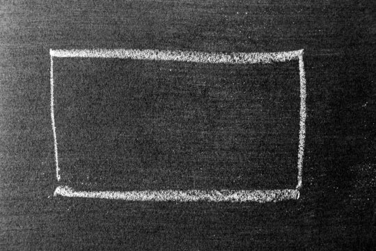 White color chalk hand drawing as square or rectangle shape on blackboard or chalkboard background with copy space