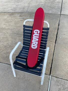 Red Lifeguard saver & white chair