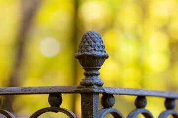 vintage cast iron fence on an autumn background