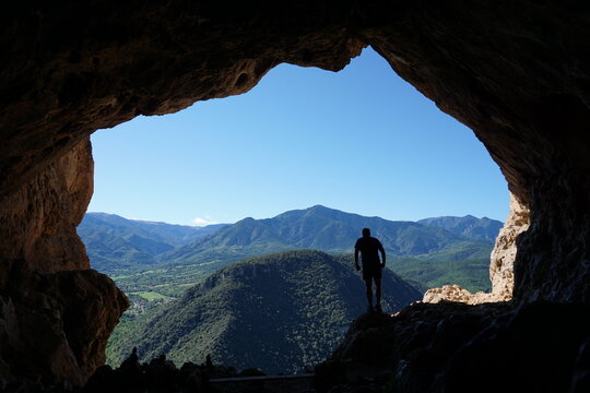 Silhoutte of hiker in Grotte Notre Dame de Vie cave in Villefranche-de-Conflent, France