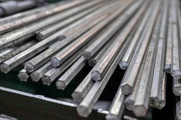 A bundle of hexagonal metal bars, steel mill products