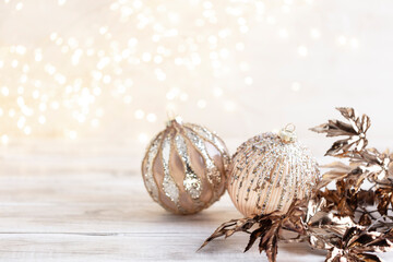 Golden christmas balls with bokeh.