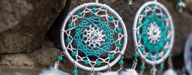 banner of Handmade dream catcher with feathers threads and beads rope hanging