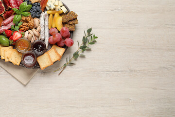 Different tasty appetizers on wooden table, flat lay. Space for text