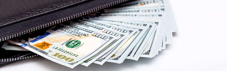 Wallet with money. US dollars close up. Cash in a man's wallet isolated on white background....