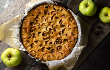 Close-up apple pie top view. Homemade autumn baking pattern.
