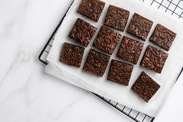 Chocolate brownie on marble background top view copy space