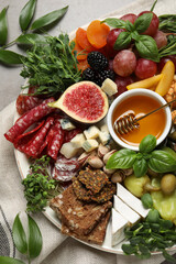 Set of different delicious appetizers served on light grey table, flat lay