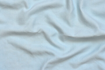 Textured blue fabric background. Crumpled smooth canvas. Element for design