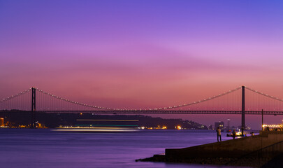 amazing sunset in Lisbon with the view of the 25th of April bridge