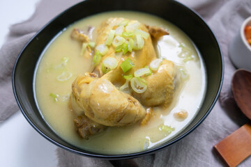 steaming samgyetang, chicken soup with ginseng korean food.