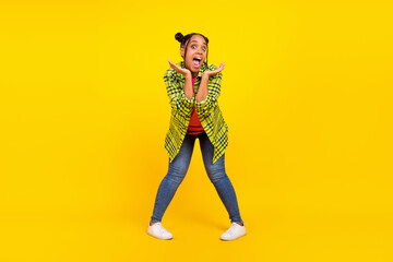 Fototapeta na wymiar Full body photo of amazed excited young afro american woman hand face crazy mood isolated on yellow color background