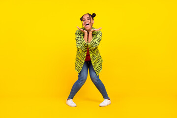 Fototapeta na wymiar Full size photo of cheerful excited young afro american woman hold hands face enjoy isolated on yellow color background