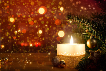 Christmas background with burning candle and fir tree branch