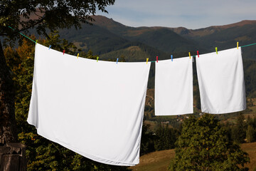 Laundry with clothes pins on line outdoors
