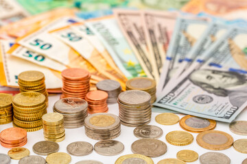 Money US dollars and Euro Coins, different monetary coins, a lot of different money finance banknotes of different countries