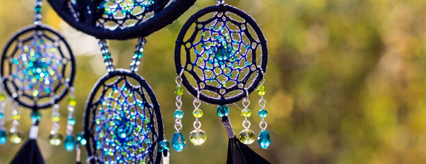 banner of Handmade dream catcher with feathers threads and beads rope hanging