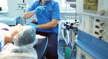 Man surgeon at work in operating room