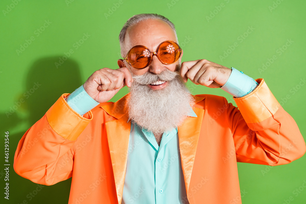 Poster portrait of attractive cheerful man wearing specs touching mustache good look isolated over bright g