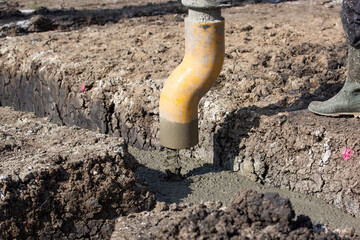 Obraz premium Concreting of foundation of the new house by automatic concrete system, building concept