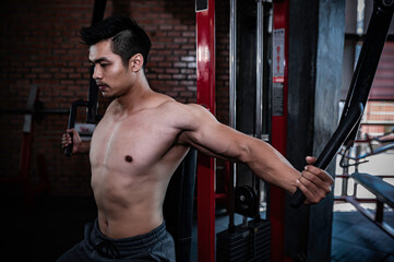 Portrait of asian man big muscle at the gym,Thailand people,Workout for good healthy,Body weight training,Fitness at the gym concept,Asia men exercise chest muscle workout