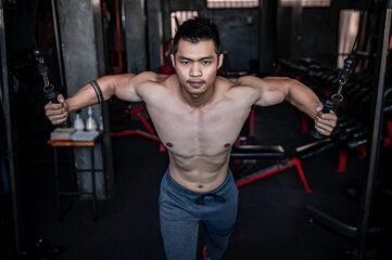 Portrait of asian man big muscle at the gym,Thailand people,Workout for good healthy,Body weight...