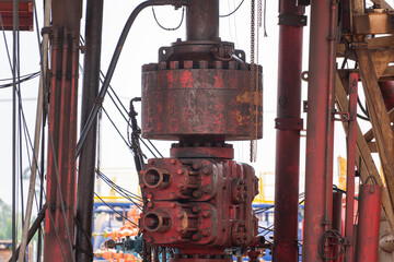 BOP (Blow out preventer) for oil drilling operation which is installed on wellhead, this equipment is using for secure hydrocarbon blowout from downhole. Heavy industrial equipment object photo. - obrazy, fototapety, plakaty