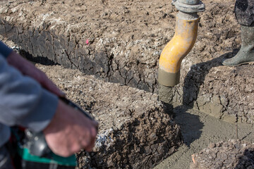 Concreting of foundation of the new house by automatic concrete system, building concept