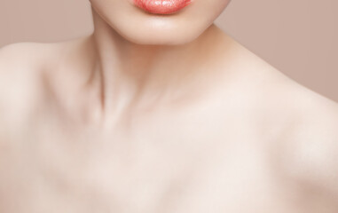 Obraz na płótnie Canvas Collar bone lips and skin care on nude beauty makeup background