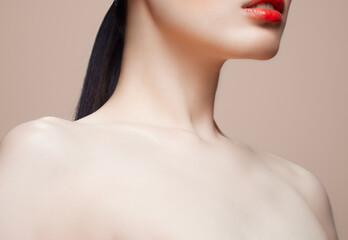 Collar bone reed lips and skin care on nude beauty makeup background