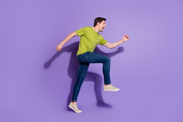 Fototapeta premium Full length body size view of attractive cheerful guy jumping running isolated over bright violet purple color background