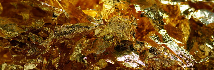 Gold leaf texture banner. Christmas shiny background.
