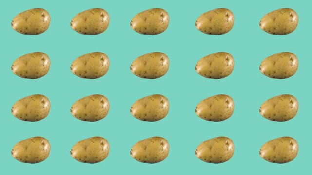Lots of rotating potatoes on a blue background. Minimalistic animated design style. Elements concept blank background template. The art of minimal motion design.