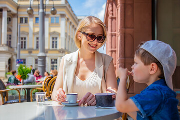 Mother with a son in a cafe on a vacation in Wroclaw, Poland