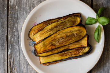 Traditional country stuffed eggplants with egg, cheese, garlic, parsley and oregano filling