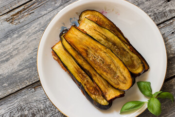 Traditional country stuffed eggplants with egg, cheese, garlic, parsley and oregano filling
