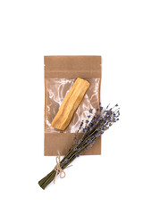 Palo Santo tree sticks in a craft bag with a bouquet of dry lavender against white background. Incense for meditation, aromatherapy, ceremonies and rituals, cleansing and healing. Isolate, close-up.